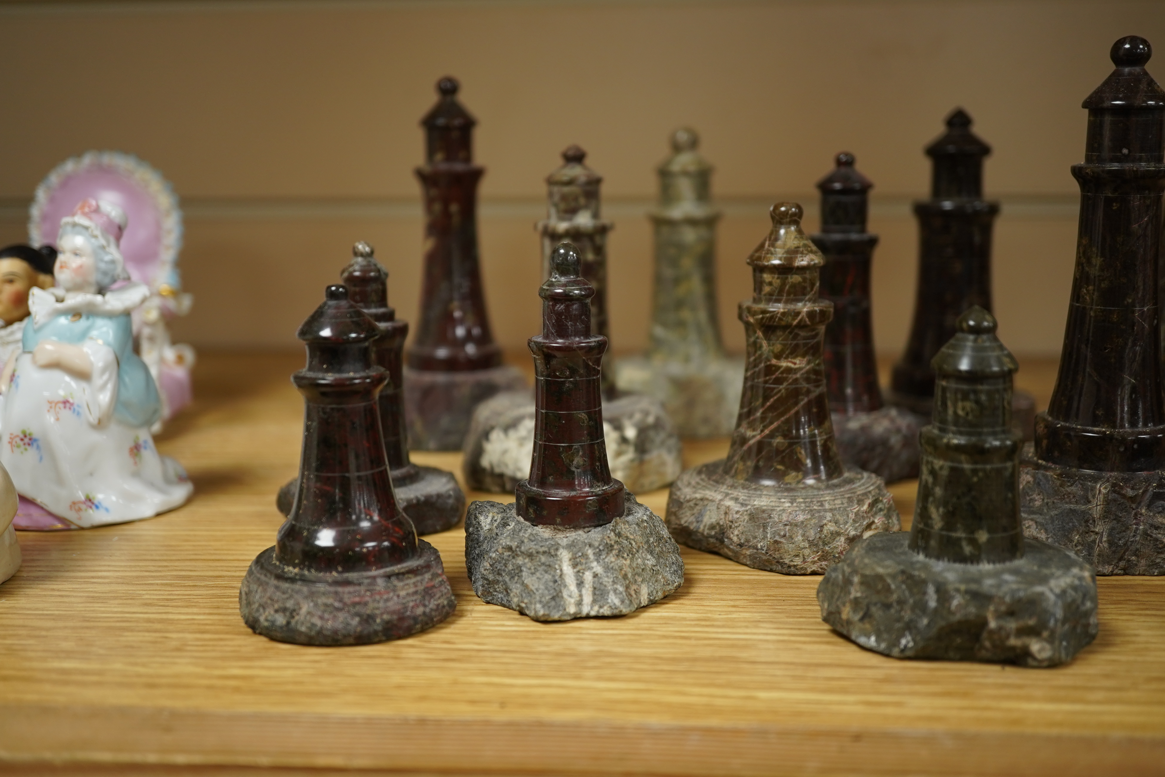 A collection of Cornish serpentine stone carved lighthouses, tallest 13cm high